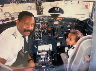 Ruben with his son in the flight deck jumpseat