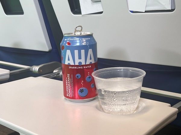 Now onboard: AHA Blueberry + Pomegranate flavored sparkling water is a refreshing beverage that can be used as a drink mixer or enjoyed on its own.
