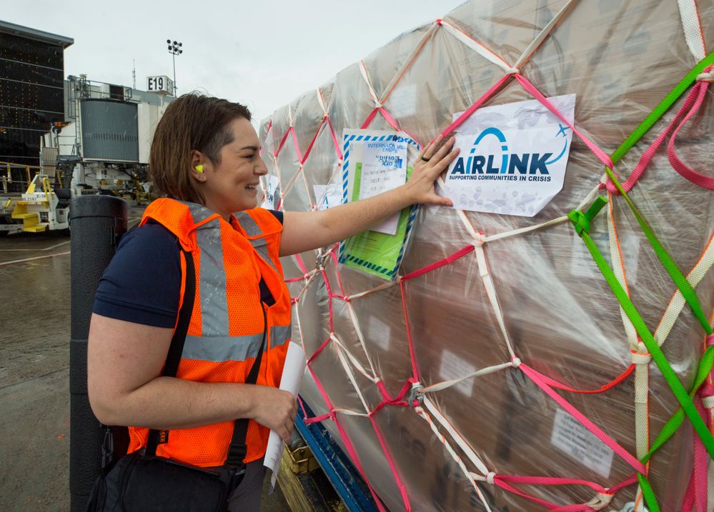 Airlink staff, Dorian, with cargo.jpg