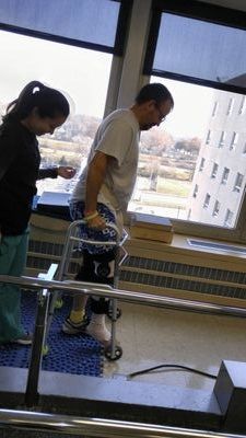 Learning to walk with two broken legs after new hardware was installed.