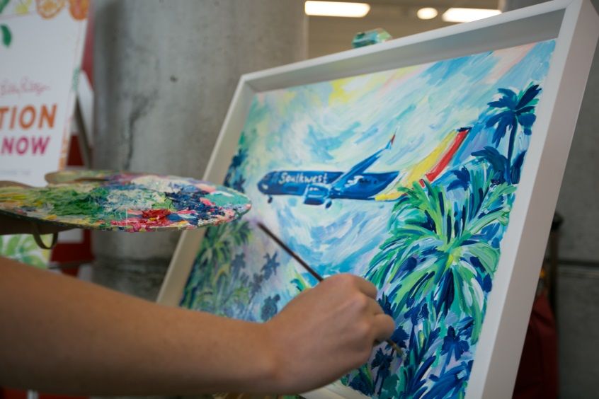 An artist painted a custom Southwest print, which was later gifted to the Southwest Employees at Fort Lauderdale.